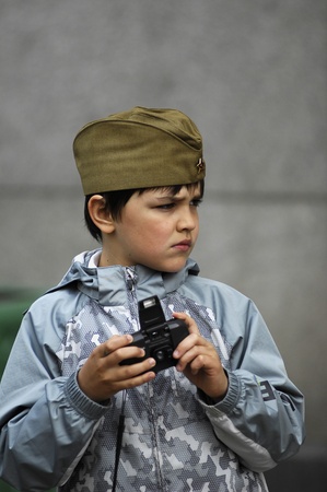 MOSCOW - MAY 6 : Unidentified boy during 65th anniversary of Victory in Great Patriotic War Military Parade at Red Square on May 6, 2010 in Moscow のeditorial素材