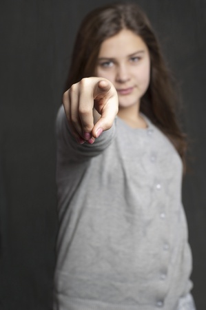 Girl is points on you. Studio workの写真素材