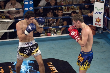 MOSCOW - SEPTEMBER 21  Winner A Aliev white  and D Klimovich yellow  fight on International tournament of Osminog fight club on September 21, 2012  Moscow, Russiaのeditorial素材