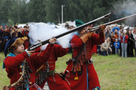 RUSSIA, MOLODI VILLAGE - JULY 27  Unidentified people shooting by rifle on event dedicated to Victory in battle near the Molodi village 1572, on July 27, 2013, in Moscow region, Russiaのeditorial素材