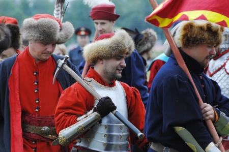 RUSSIA, MOLODI VILLAGE - JULY 27: Unidentified people walk by on event dedicated to Victory in battle near the Molodi village 1572, on July 27, 2013, in Moscow region, Russiaのeditorial素材