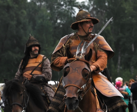 RUSSIA, MOLODI VILLAGE - JULY 27: Unidentified people ride the horses on event dedicated to Victory in battle near the Molodi village 1572, on July 27, 2013, in Moscow region, Russiaのeditorial素材