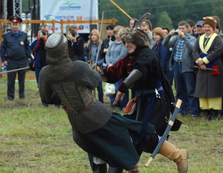 RUSSIA, MOLODI VILLAGE - JULY 27: Unidentified people fights by the swords  on event dedicated to...