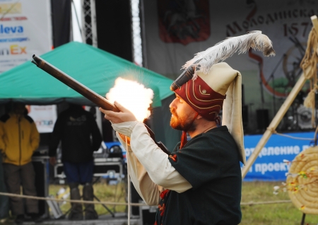 RUSSIA, MOLODI VILLAGE - JULY 27  Unidentified man shooting a musket on event dedicated to Victory...