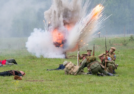RUSSIA, CHERNOGOLOVKA - MAY 17: Unidentified men in military uniform sit on ground under explosion...