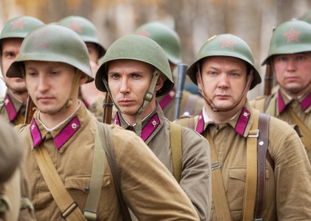 RUSSIA, BORODINO - OCTOBER 12: Unidentified soldiers in row on reenactment of the battle in WWII near the Borodino village in 1941, in Moscow region, Borodino, on 12 October, 2014, Russiaのeditorial素材