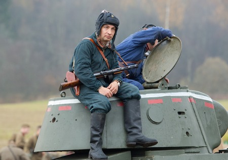 RUSSIA, BORODINO - OCTOBER 12: Unidentified tankman rest on tower on reenactment of the battle in WWII near the Borodino village in 1941, in Moscow region, Borodino, on 12 October, 2014, Russiaのeditorial素材