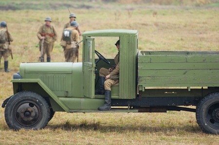 RUSSIA, BORODINO - OCTOBER 12: Unidentified driver sit in truck cabine on reenactment of the battle in WWII near the Borodino village in 1941, in Moscow region, Borodino, on 12 October, 2014, Russiaのeditorial素材