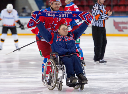 MOSCOW - DECEMBER 3: Unidentified disabled hockey fan on wheelchair just before game CSKA vs Severstal on Russian KHL premier hockey league Championship on December 3, 2014, in Moscow, Russia. CSKA won 9:1のeditorial素材