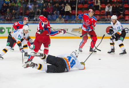 MOSCOW - DECEMBER 3: Shefer A (18) fall down on game CSKA vs Severstal on Russian KHL premier hockey league Championship on December 3, 2014, in Moscow, Russia. CSKA won 9:1のeditorial素材