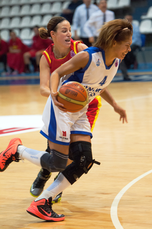 MOSCOW - DECEMBER 4, 2014: Katerina Keyru (4) atack on the International Europe bascketball league match Dynamo Moscow vs Maccabi Ashdod Israel in sport palace Krilatskoe, Moscow, Russia. Dynamo loss 59:67のeditorial素材