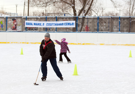 MOSCOW - JANUARY 25: Unidentified man run with a stick on family sport event on January 25, 2015 in...