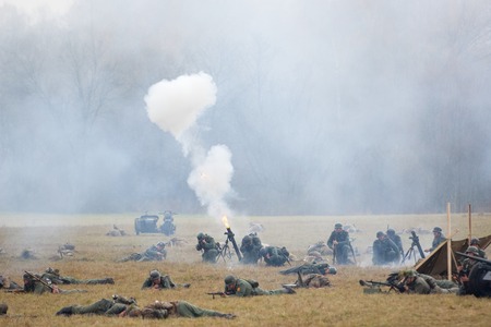 RUSSIA, BORODINO - OCTOBER 12: Unidentified soldiers shooting by grenade launcher on reenactment of the battle in WWII near the Borodino village in 1941, in Moscow region, Borodino, on 12 October, 2014, Russiaのeditorial素材