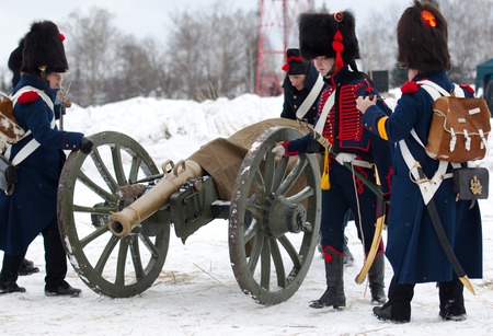 RUSSIA, APRELEVKA - FEBRUARY 7: Unidentified soldiers of cannon squad moving cannon on reenactment...