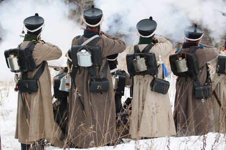 RUSSIA, APRELEVKA - FEBRUARY 7: Unidentified soldiers shooting on reenactment of the Napoleonic maneuvers near the Aprelevka city, in 1812. Moscow region, Aprelevka, 7 February, 2015, Russiaのeditorial素材