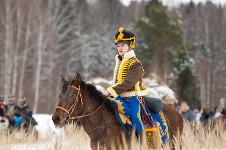 RUSSIA, APRELEVKA - FEBRUARY 7: Unidentified cavalry soldier ride on horse on reenactment of the Napoleonic maneuvers near the Aprelevka city, in 1812. Moscow region, Aprelevka, 7 February, 2015, Russiaのeditorial素材