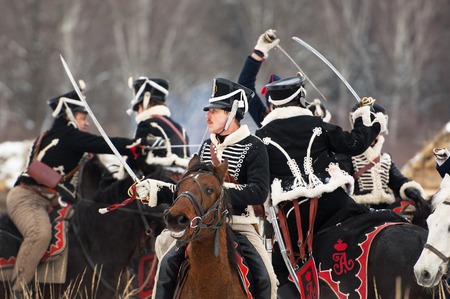 RUSSIA, APRELEVKA - FEBRUARY 7: Unidentified cavalry fight by swords on reenactment of the Napoleonic maneuvers near the Aprelevka city, in 1812. Moscow region, Aprelevka, 7 February, 2015, Russiaのeditorial素材