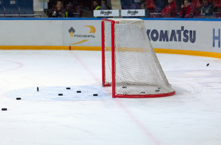 MOSCOW - MARCH 12: Empty gate with puck around  just after training on hockey game Yokerit vs CSKA on Russia KHL championship on March 12, 2015, in Moscow, Russiaのeditorial素材