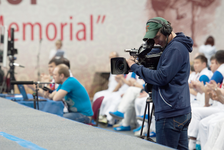 RUSSIA, MOSCOW - MARCH 27: Unidentified cmeraman filming on World Sambo Championship Kharlampiev memorial in Luzhniki sport palace, Moscow, Russia, 2015のeditorial素材