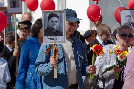RUSSIA ROSTOV CITY  MAY 9: Unidentified man walk on Victory day parade dedicated 70 anniversary of WWII end on May 9 2015 in Yaroslavl region Rostov the Great city Russiaのeditorial素材