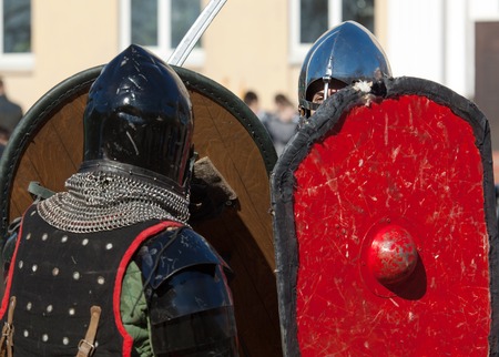 RUSSIA, MOSCOW - MARCH 14: Unidentified knights under shields protection on  tournament on history reenactment of the Medieval maneuvers in Moscow, 14 March, 2015, Russiaのeditorial素材