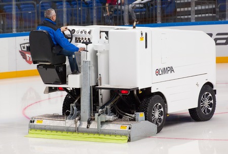 RUSSIA, MOSCOW - APRIL 27, 2015: Unidentified man repair the rinks ice on hockey game CSKA vs SKA...