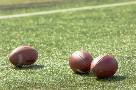 RUSSIA, TROITSK CITY - JULY 11:  Balls on the grass on Russian american football Championship game...