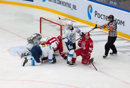 MOSCOW - OCTOBER 17, 2015: A. Ivanov 28 and R. Horak 15 fight on a gate during hockey game Vityaz vs Barys on Russia KHL championship on October 17, 2015, in Moscow, Russia. Vityaz won 4:3のeditorial素材