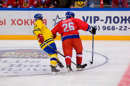 MOSCOW - JANUARY 29, 2016: J. Krasny (26) vs W. Lindstrom (20) during hockey game Sweden vs Czech on League of World legends of Ice hockey championship in VTB ice arena, Russia. Czech won 8:2のeditorial素材