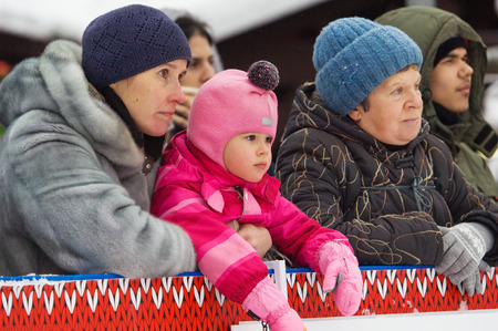 MOSCOW - JANUARY 17, 2016: Unidentified Mom, grandma and doughter on tribune during Russian Curling Champions Tour Moscow Classic 2016 on January 17, in Moscow, Russia, 2016のeditorial素材