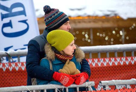 MOSCOW - JANUARY 17, 2016: Unidentified man and girl on tribune during Russian Curling Champions Tour Moscow Classic 2016 on January 17, in Moscow, Russia, 2016のeditorial素材