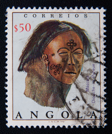 MOSCOW RUSSIA - NOVEMBER 25, 2012: A stamp printed in Angola shows leather mask with painted decoration, circa 1976のeditorial素材