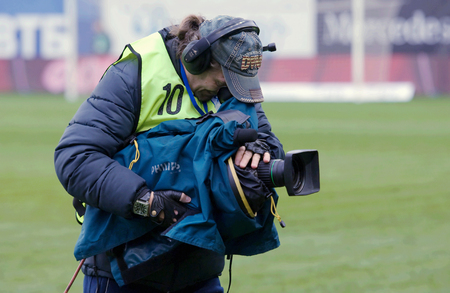 MOSCOW, RUSSIA - OCTOBER 8, 2016: Unidentified reporter with camera on Football Cup of Russia game FC Dynamo Moscow vs FC Kuban Krasnodar (1:0), October 8, 2016のeditorial素材