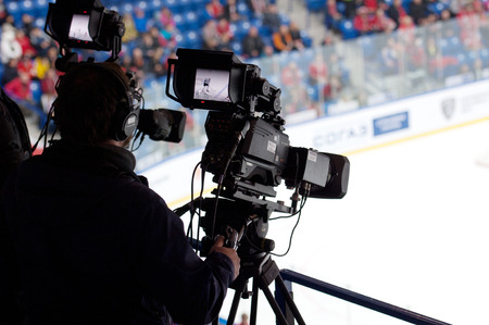 PODOLSK - OCTOBER 30, 2016: Unidentified cameraman on ice hockey game on hockey game Vityaz vs Dynamo Minsk on Russia KHL championship on October 30, 2016, in Podolsk, Russia. Vityaz won 9:6のeditorial素材