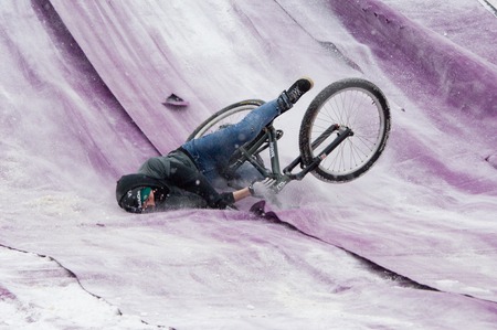 MOSCOW, RUSSIA - DECEMBER 10, 2016: Unidentified rider fall down on bike trampoline on Winter game season opening event on December 10, 2016のeditorial素材