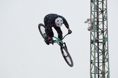 MOSCOW, RUSSIA - DECEMBER 10, 2016: Unidentified rider jump on bike trampoline on Winter game season opening event on December 10, 2016のeditorial素材