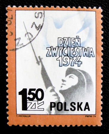 MOSCOW, RUSSIA - JANUARY 7, 2017: A stamp printed in Poland shows a soldier and dove, circa 1974のeditorial素材