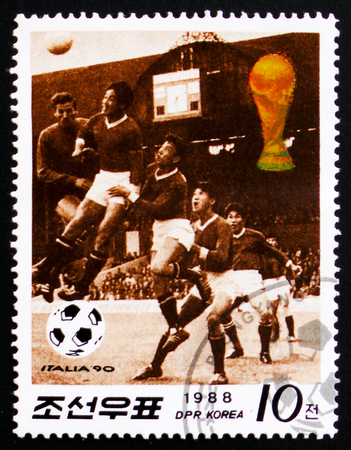 MOSCOW, RUSSIA - FEBRUARY 12, 2017: A Stamp printed in Korea shows football players devoted to World Cup in Italy 1990, circa 1988のeditorial素材