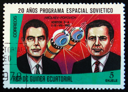 MOSCOW, RUSSIA - APRIL 2, 2017: A stamp printed in Guinea Equatorial shows Vostok 3 and 4 spaceship, 1962, and portraits of astronauts P. Popovich and R. Nikolaev, circa 1978のeditorial素材