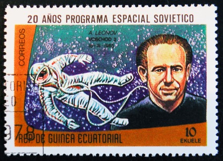 MOSCOW, RUSSIA - APRIL 2, 2017: A stamp printed in Guinea Equatorial shows Voskhod 2 space project 1962, and portrait of astronaut A. Leonov, circa 1978のeditorial素材