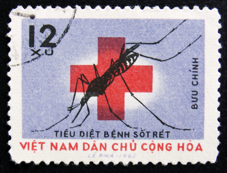 MOSCOW, RUSSIA - APRIL 2, 2017: A post stamp printed in Vietnam shows Soaking mosquito and red cross, Fights against Malaria, circa 1962のeditorial素材