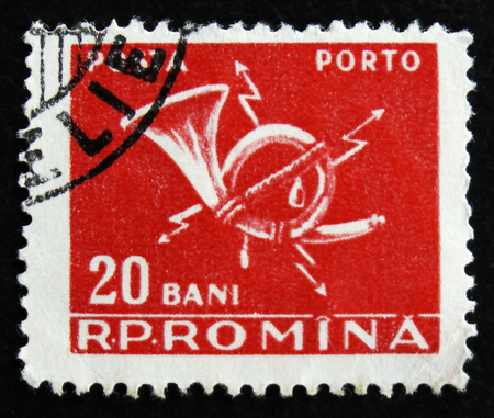 MOSCOW, RUSSIA - APRIL 2, 2017: A post stamp printed in Romania shows post horn, circa 1967のeditorial素材