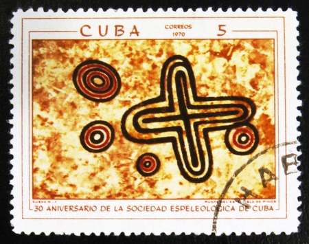 MOSCOW, RUSSIA - JULY 15, 2017: A stamp printed in Cuba shows prehistoric rock paintings, the series...