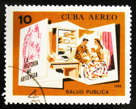 MOSCOW, RUSSIA - JULY 15, 2017: A stamp printed in Cuba shows Doctor and family with the inscription "Public health" from the series "Conquests of the Revolution", circa 1966のeditorial素材