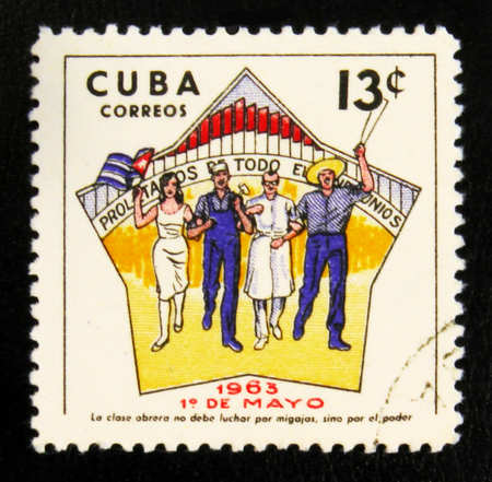 MOSCOW, RUSSIA - JULY 15, 2017: A stamp printed in Cuba shows Cuban people rejoice in the celebration of Labour Day on 1 May, circa 1963のeditorial素材