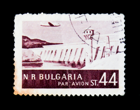 MOSCOW, RUSSIA - JUNE 26, 2017: A stamp printed in Bulgaria shows dam, lighthouse and plane, circaのeditorial素材