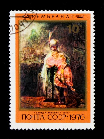 MOSCOW, RUSSIA - JUNE 26, 2017: A stamp printed in USSR (Russia) shows a crying servant and soldier, Paint by Rembrandt, David and Jonathan, circa 1976のeditorial素材