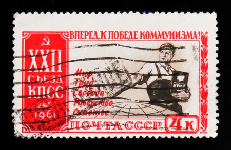 MOSCOW, RUSSIA - JUNE 26, 2017: A stamp printed in USSR (Russia) shows a communist man that offers peace, work, liberty, equality and happiness, 22nd Congress of the Communist Party of the Soviet Union, circa 1961のeditorial素材