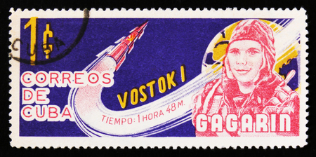MOSCOW, RUSSIA - JUNE 26, 2017: A stamp printed in Cuba shows portraits of Gagarin, Soviet cosmonaut, with rocket Vostok 1, circa 1963のeditorial素材