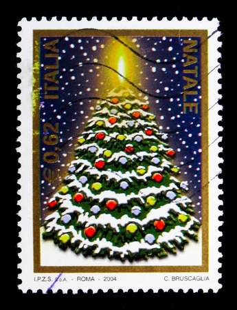 MOSCOW, RUSSIA - MAY 10, 2018: A stamp printed in Italy shows Christmas tree, serie, circa 2004のeditorial素材